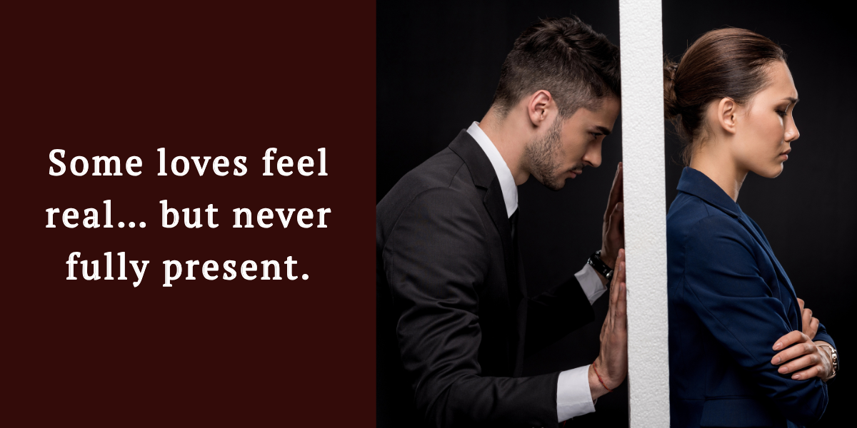 A couple standing apart divided by a wall, symbolizing the emotional distance often felt when loving emotionally unavailable men